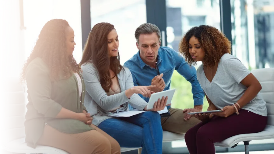 A team reviewing an AI deployment roadmap together on a tablet